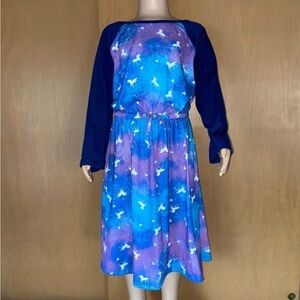 SO long sleeve dress has unicorns prancing among the cosmos with little hearts.